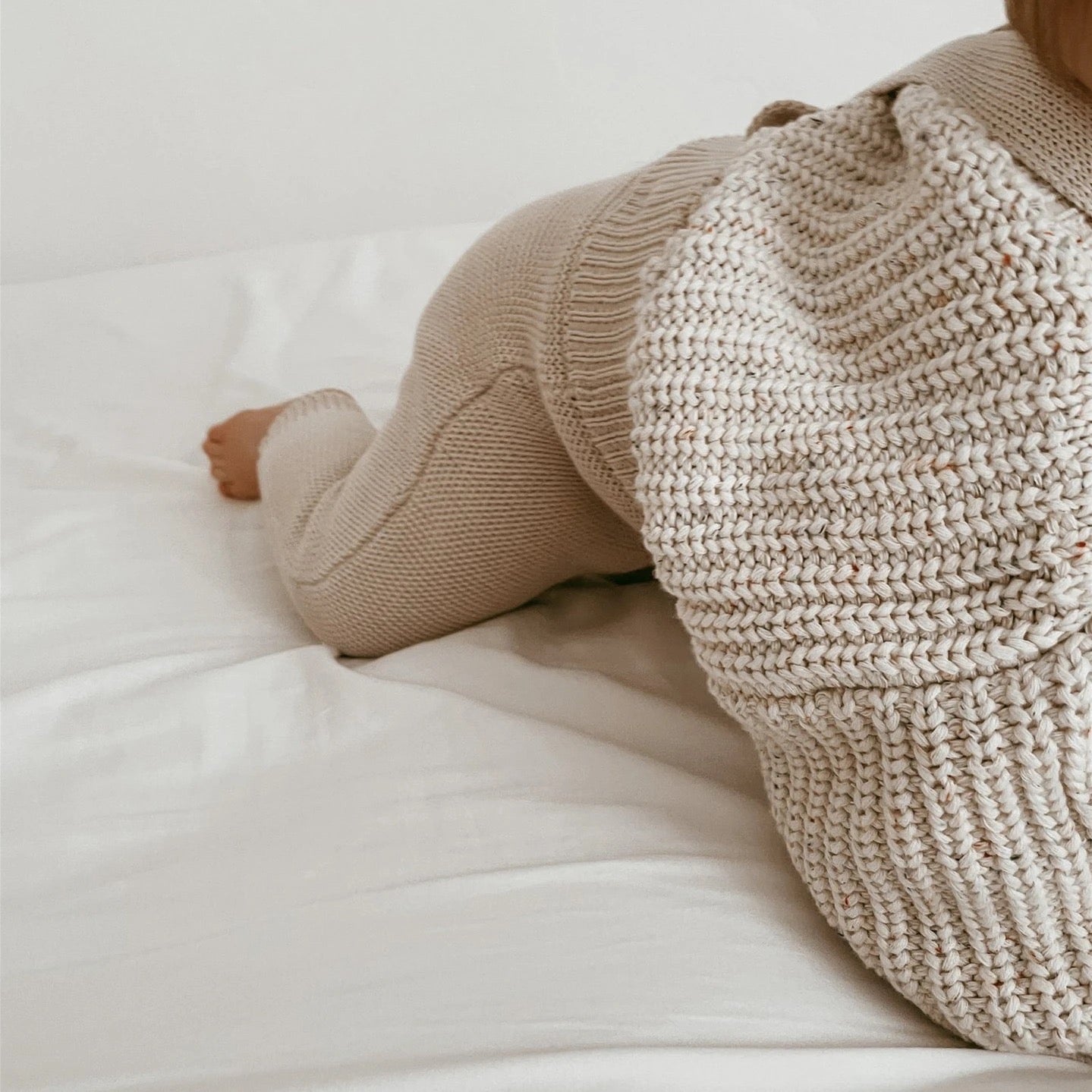 Beige knitted baby sweater